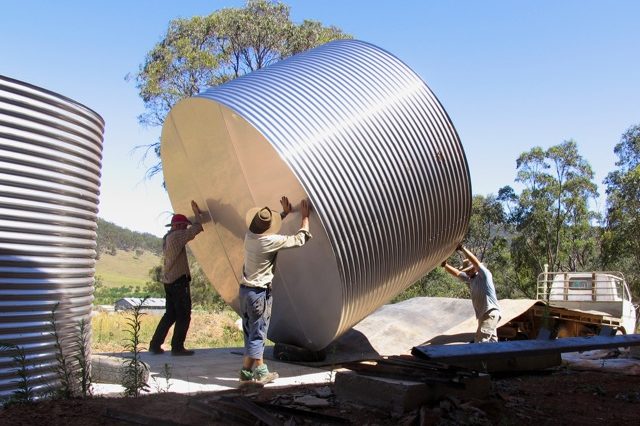 Jesse, Nick and Ryan manouvre the second tank towards its final resting place