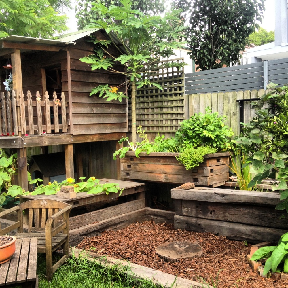 ... small yard. And her garden grows fun, food and fish… right next to