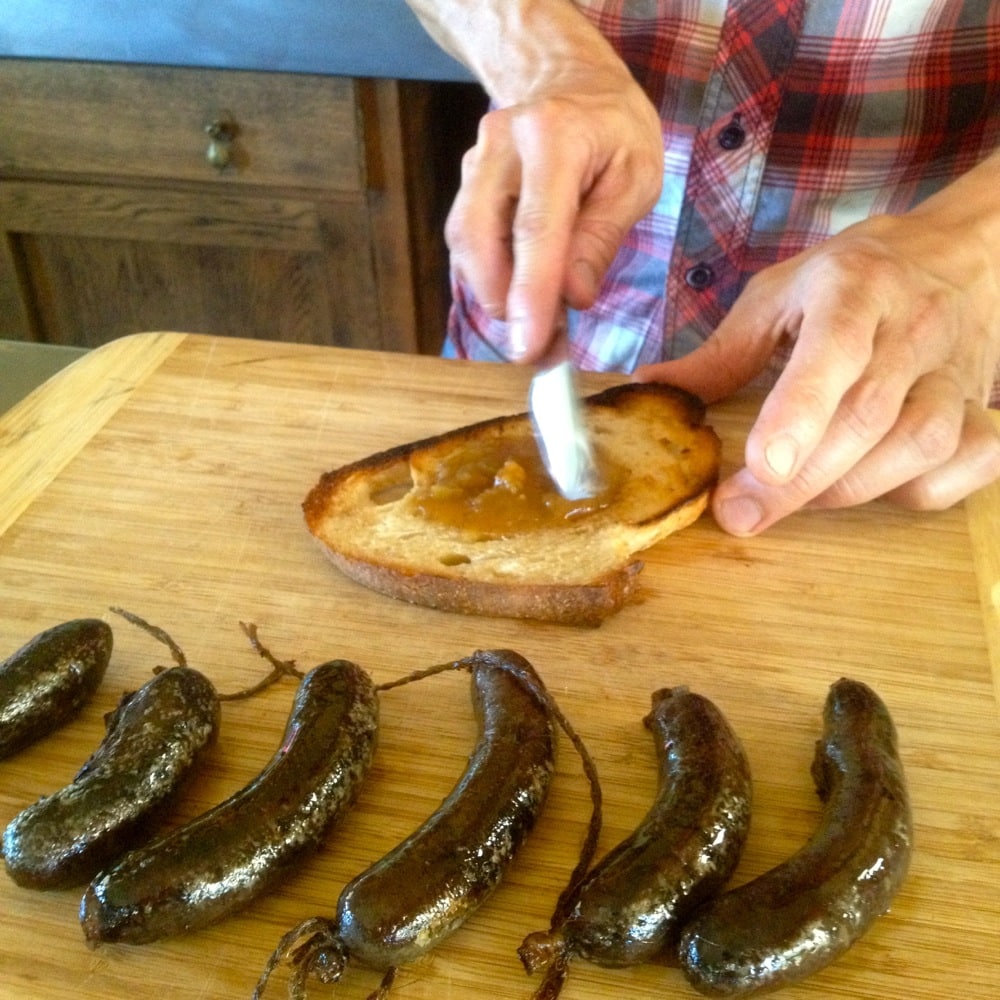 After simmering, the blood sausages are fried up and served with whatever takes your fancy