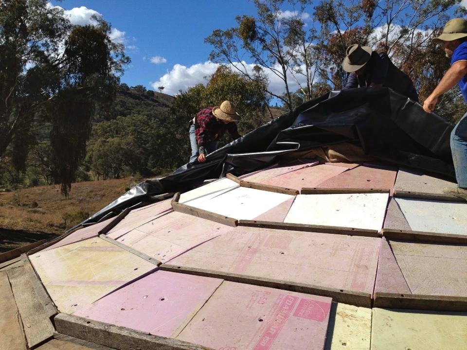 Waterproof lining over insulation, with lots of cross-bars to help hold soil in place, once we add that on top