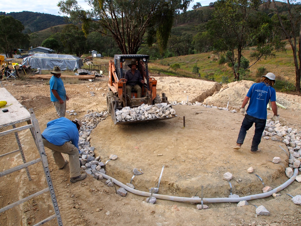 Foundations going in - a french drain to carry water away, with rubble footings ontop