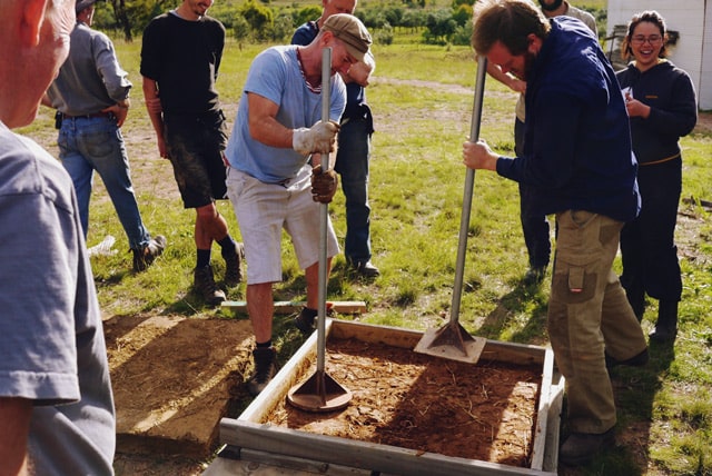 earth floor demo at Milkwood's Natural Building course