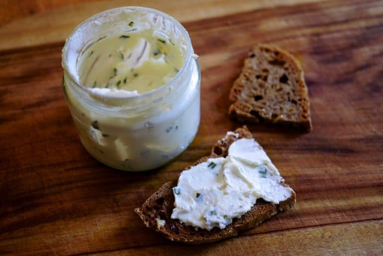 Kefir cheese spread on rye bread beside the jar