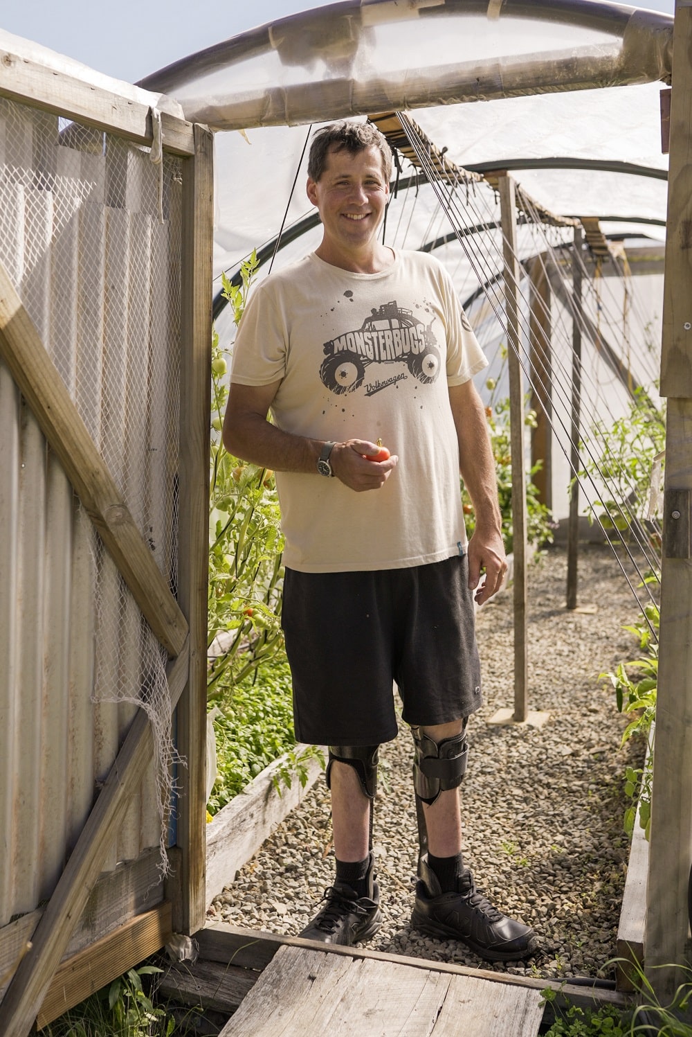 Grant Bailey in his polytunnel, which has been modified for increased accessibility.