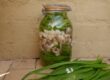 Delicious pickled mushrooms in a jar.