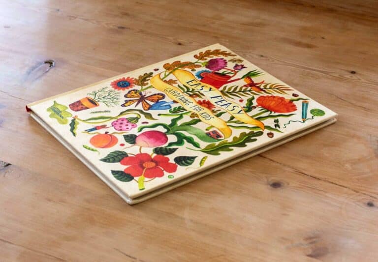 Easy Peasy lying on a wooden table, showing the hardcover front