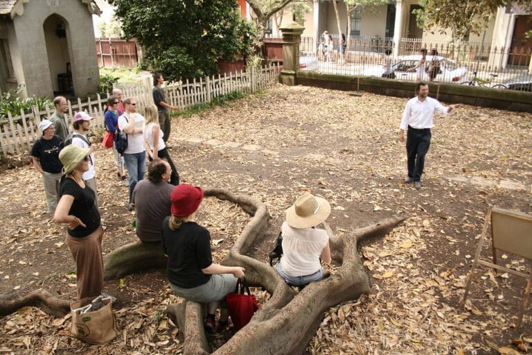 classroom under the fig tree Permaculture design course class gathered in a garden under a fig tree in Newtown